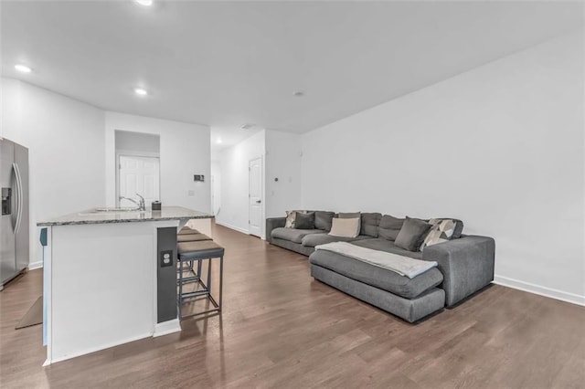5668 Union Pointe Dr, Union City, GA 30291 - living room with recessed lighting, dark wood-style flooring, and baseboards
