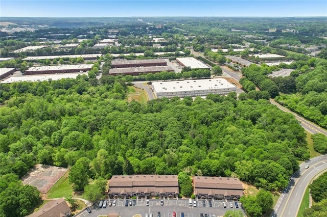 drone / aerial view with a view of trees