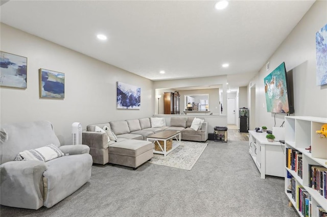 living room with carpet and recessed lighting