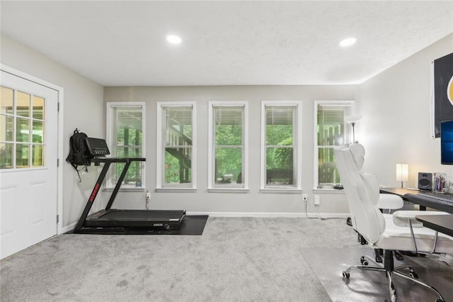 interior space with baseboards and recessed lighting