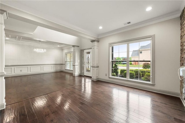 4015 Roberts Crest Ln, Suwanee, GA 30024 - unfurnished living room featuring decorative columns, dark wood-style flooring, a chandelier, ornamental molding, and recessed lighting