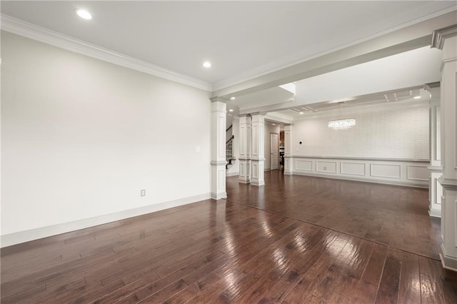 4015 Roberts Crest Ln, Suwanee, GA 30024 - empty room featuring ornate columns, dark wood finished floors, ornamental molding, and recessed lighting