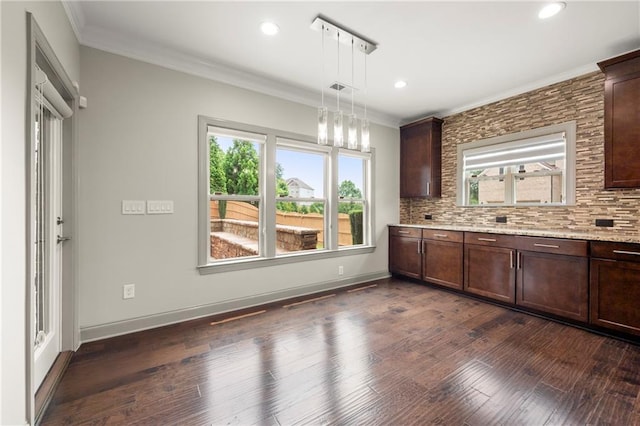4015 Roberts Crest Ln, Suwanee, GA 30024 - kitchen with crown molding, dark brown cabinets, pendant lighting, decorative backsplash, and recessed lighting
