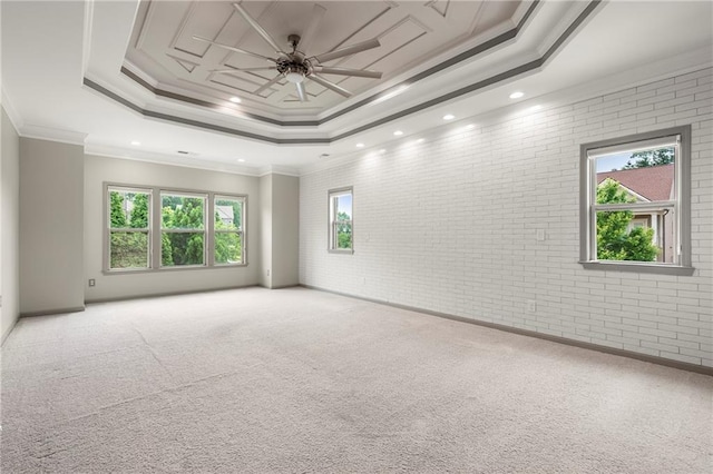 4015 Roberts Crest Ln, Suwanee, GA 30024 - unfurnished room with a raised ceiling, brick wall, light colored carpet, crown molding, and ceiling fan