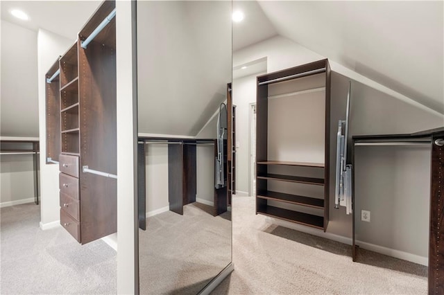 4015 Roberts Crest Ln, Suwanee, GA 30024 - walk in closet featuring carpet and vaulted ceiling