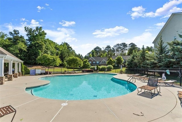 4015 Roberts Crest Ln, Suwanee, GA 30024 - community pool with a patio area and view of wooded area