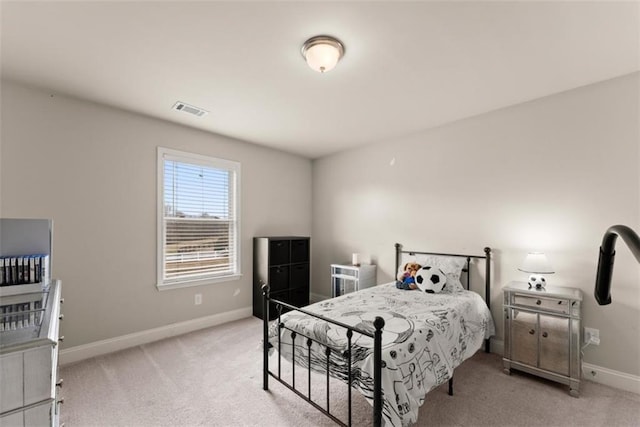 bedroom featuring light colored carpet