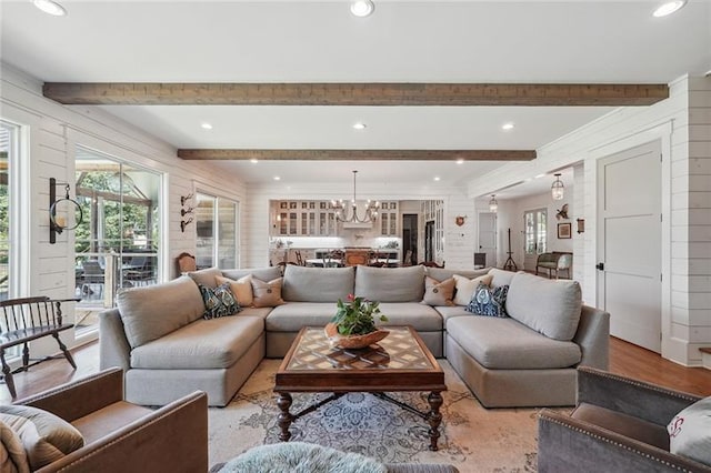 3842 Ernest W Barrett Pkwy SW, Marietta, GA 30064 - living area with healthy amount of natural light, a chandelier, beam ceiling, recessed lighting, and wood finished floors