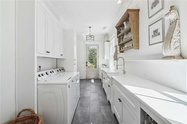 3842 Ernest W Barrett Pkwy SW, Marietta, GA 30064 - laundry room featuring cabinet space, independent washer and dryer, and a chandelier