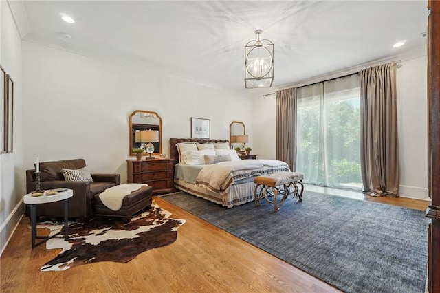 3842 Ernest W Barrett Pkwy SW, Marietta, GA 30064 - bedroom featuring wood finished floors, access to outside, a chandelier, baseboards, and recessed lighting