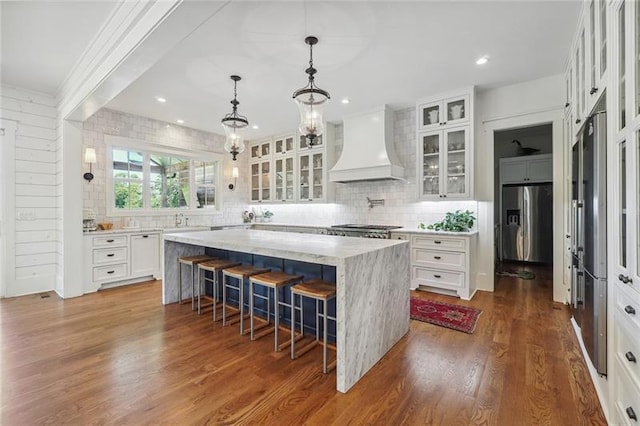 3842 Ernest W Barrett Pkwy SW, Marietta, GA 30064 - kitchen featuring custom exhaust hood, stainless steel fridge, a kitchen island, backsplash, and recessed lighting