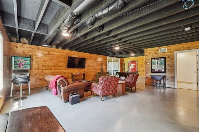 3842 Ernest W Barrett Pkwy SW, Marietta, GA 30064 - living room with wooden walls and finished concrete floors