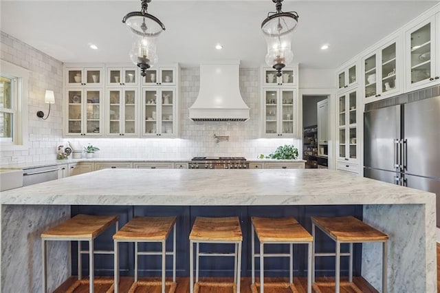 3842 Ernest W Barrett Pkwy SW, Marietta, GA 30064 - kitchen with stainless steel appliances, premium range hood, tasteful backsplash, and white cabinets