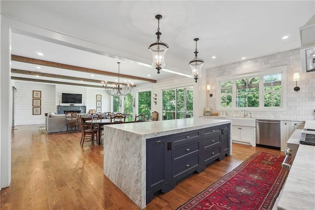 3842 Ernest W Barrett Pkwy SW, Marietta, GA 30064 - kitchen featuring dishwasher, a chandelier, pendant lighting, a kitchen island, and wood finished floors