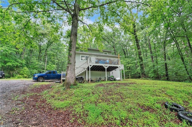 504 J C Daniel Rd, Carrollton, GA 30117 - rear view of property featuring stairs, a deck, and a forest view