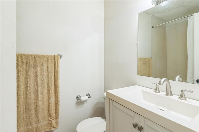 504 J C Daniel Rd, Carrollton, GA 30117 - bathroom with vanity, toilet, and a shower with curtain