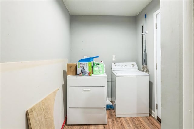 504 J C Daniel Rd, Carrollton, GA 30117 - laundry room with separate washer and dryer and light wood-style flooring