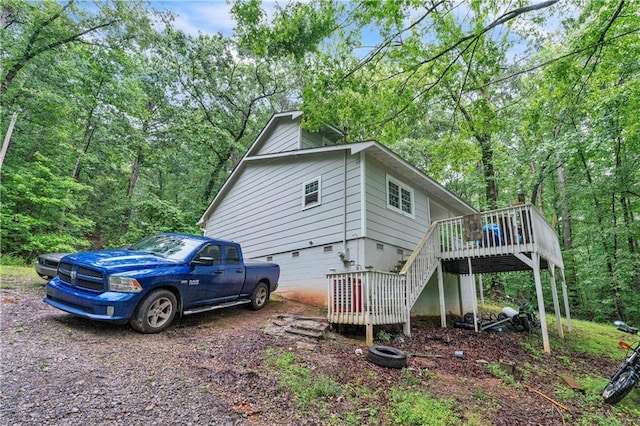 504 J C Daniel Rd, Carrollton, GA 30117 - view of side of property with stairway, a deck, and crawl space
