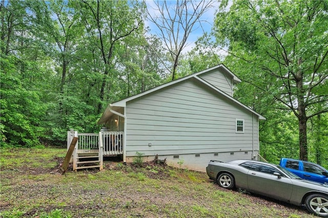 504 J C Daniel Rd, Carrollton, GA 30117 - view of side of property with crawl space, a deck, and an attached garage