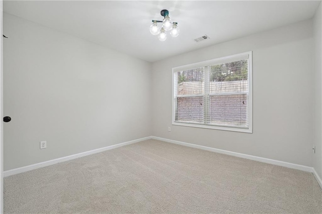 unfurnished room with carpet flooring