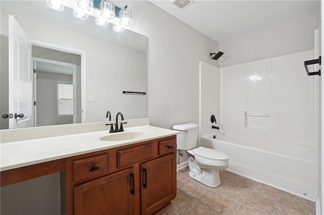 full bathroom featuring shower / tub combination, vanity, toilet, and tile patterned floors