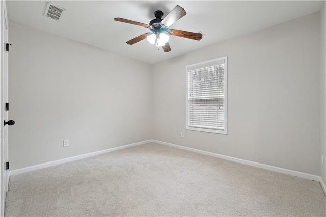 unfurnished room with ceiling fan and light carpet