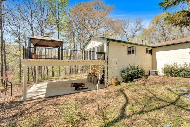 481 Patillo Rd, Stockbridge, GA 30281 - view of property exterior with a patio, stucco siding, and cooling unit