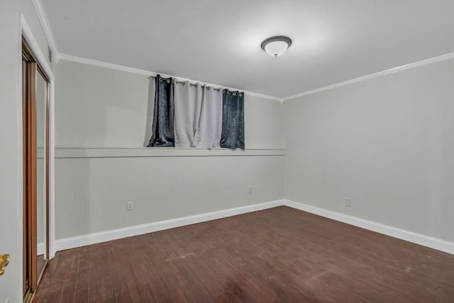 481 Patillo Rd, Stockbridge, GA 30281 - unfurnished bedroom with dark wood-style flooring, ornamental molding, a closet, and baseboards