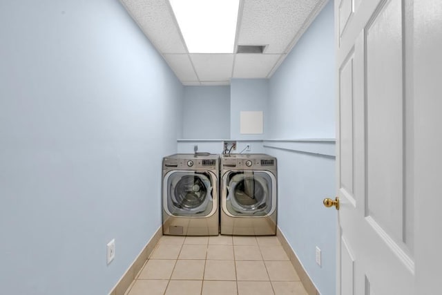 481 Patillo Rd, Stockbridge, GA 30281 - washroom featuring independent washer and dryer, baseboards, and light tile patterned floors
