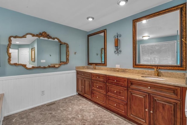 481 Patillo Rd, Stockbridge, GA 30281 - bathroom featuring a wainscoted wall and double vanity