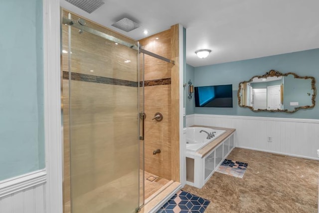 481 Patillo Rd, Stockbridge, GA 30281 - full bathroom featuring wainscoting, a stall shower, and a garden tub