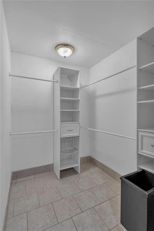 481 Patillo Rd, Stockbridge, GA 30281 - walk in closet with light stone finish flooring