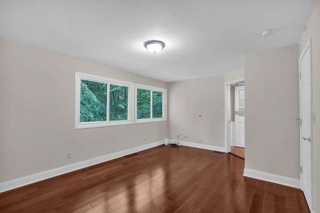 481 Patillo Rd, Stockbridge, GA 30281 - unfurnished bedroom featuring wood finished floors and baseboards