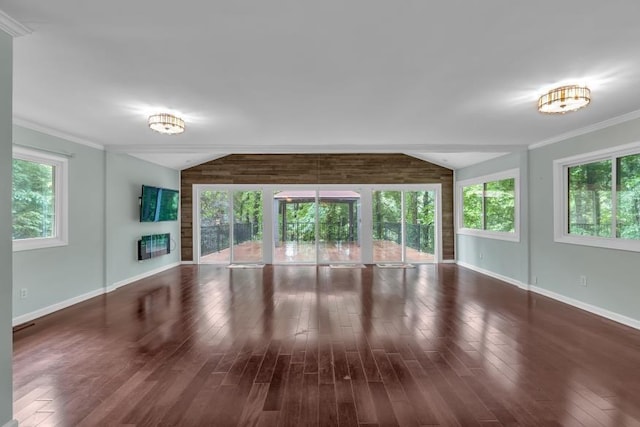 481 Patillo Rd, Stockbridge, GA 30281 - unfurnished living room with baseboards, plenty of natural light, wood finished floors, and crown molding