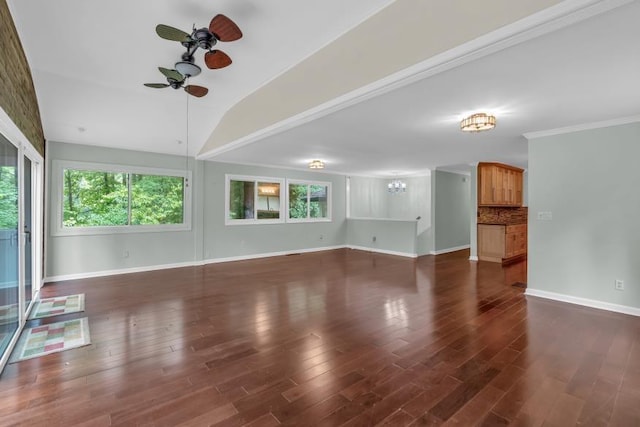 481 Patillo Rd, Stockbridge, GA 30281 - unfurnished living room with healthy amount of natural light, a ceiling fan, baseboards, dark wood-style flooring, and vaulted ceiling