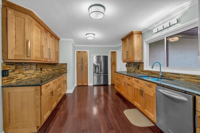 481 Patillo Rd, Stockbridge, GA 30281 - kitchen featuring stainless steel appliances, a sink, crown molding, dark stone countertops, and backsplash