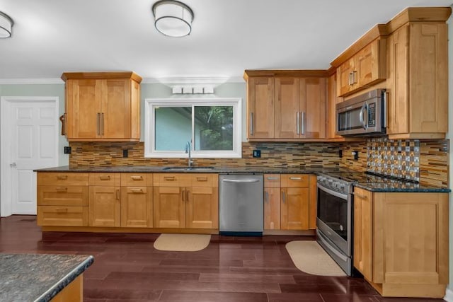 481 Patillo Rd, Stockbridge, GA 30281 - kitchen featuring stainless steel appliances, a sink, crown molding, dark stone counters, and tasteful backsplash