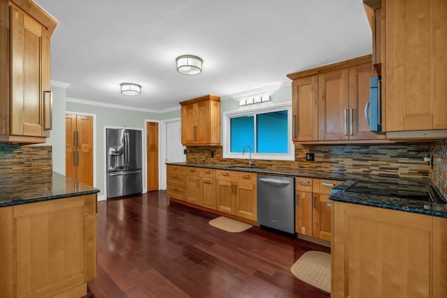481 Patillo Rd, Stockbridge, GA 30281 - kitchen featuring stainless steel appliances, crown molding, backsplash, dark wood-style flooring, and a sink
