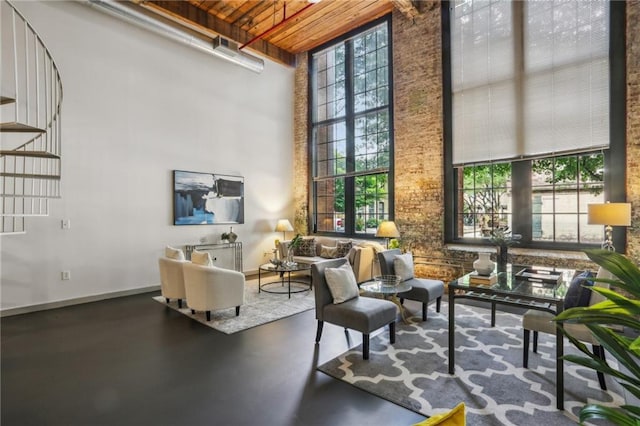 170 Boulevard Se E127, Atlanta, GA 30312 - living area with a towering ceiling, wood ceiling, stairs, and baseboards