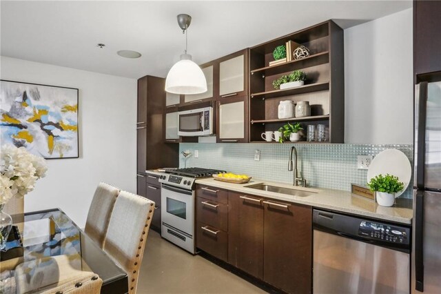 170 Boulevard Se E127, Atlanta, GA 30312 - kitchen featuring appliances with stainless steel finishes, a sink, dark brown cabinetry, tasteful backsplash, and open shelves