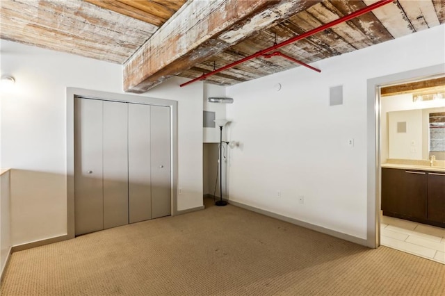 170 Boulevard Se E127, Atlanta, GA 30312 - unfurnished bedroom with a sink, a closet, light carpet, ensuite bath, and baseboards
