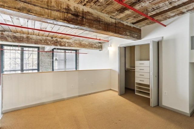 170 Boulevard Se E127, Atlanta, GA 30312 - unfurnished bedroom with carpet flooring, baseboards, and wood ceiling