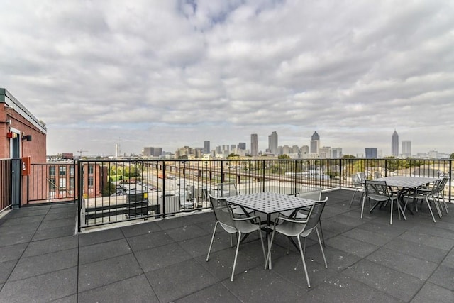 170 Boulevard Se E127, Atlanta, GA 30312 - view of patio / terrace featuring a view of skyline and outdoor dining area