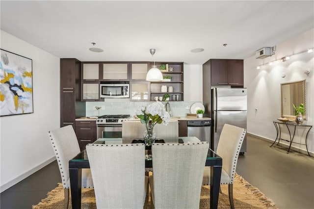 170 Boulevard Se E127, Atlanta, GA 30312 - dining room with finished concrete flooring and baseboards