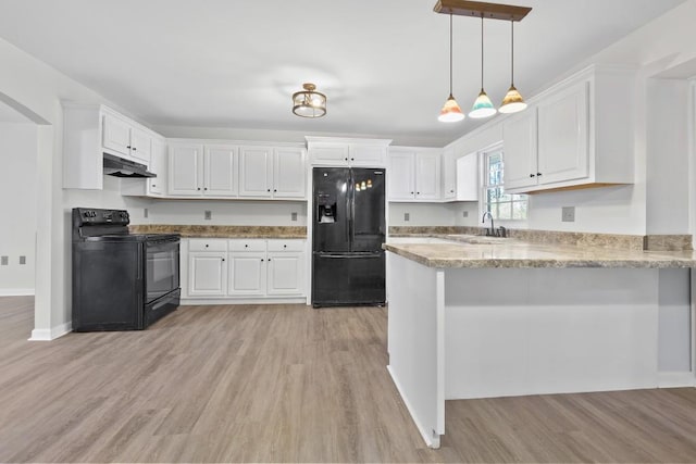 kitchen with white cabinetry, under cabinet range hood, black appliances, and a peninsula