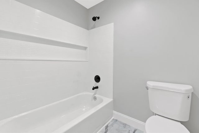 full bath with toilet, marble finish floor, washtub / shower combination, and baseboards