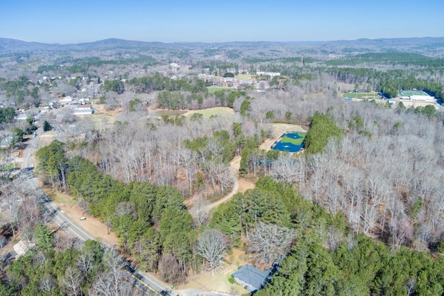 aerial view with a forest view and a mountain view