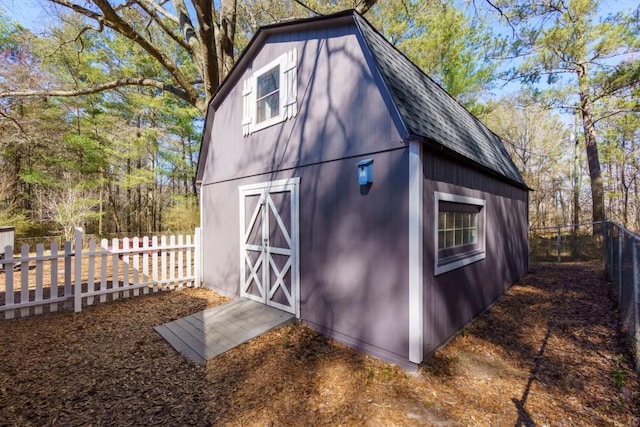 view of barn with a fenced backyard