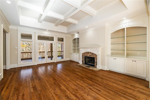 unfurnished living room featuring coffered ceiling, crown molding, dark hardwood / wood-style floors, built in features, and beam ceiling