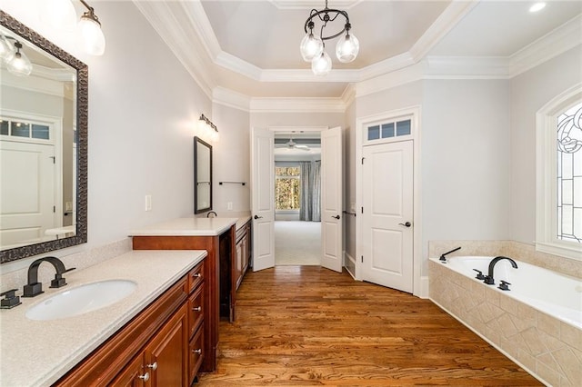 bathroom with crown molding, plenty of natural light, and hardwood / wood-style floors